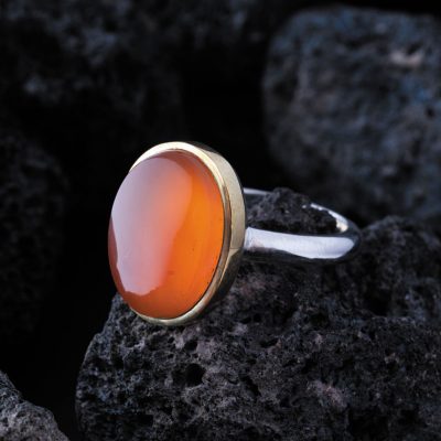 نگین عقیق پرتقالی یمن با تراش دامله، ابعاد 12*16 میلی‌متر